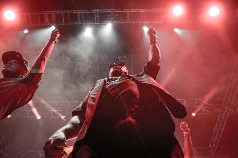 Vibrant Moroccan night cultural show at a luxury Marrakech resort, featuring traditional dancers and live Gnaoua music, creating an unforgettable authentic evening entertainment experience in Morocco.