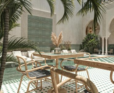 Luxury Moroccan riad interior showcasing modern comfort blended with traditional Zellige tiles and Tadelakt walls, offering an authentic yet contemporary stay.