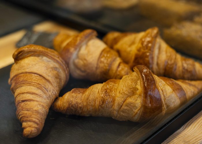 high-angle-delicious-croissants-tray